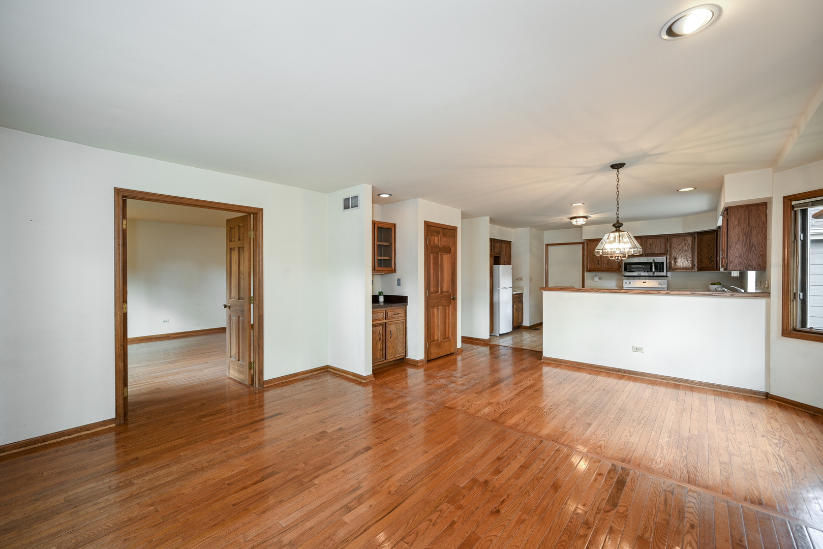 520 Renn Court Wheaton, IL 60187 - Photo 8 of 33 a view of a kitchen with wooden floor and a kitchen