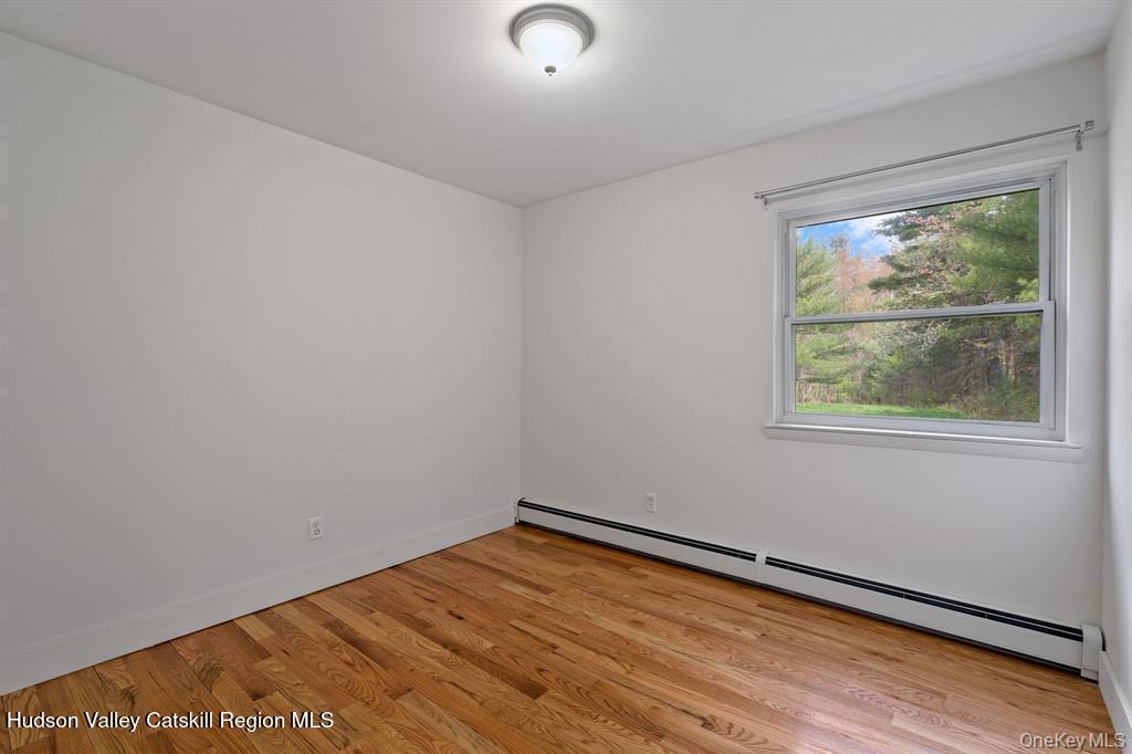 2 Mountain Valley Road Boiceville, NY 12412 - Photo 13 of 42 a view of an empty room with wooden floor and a window