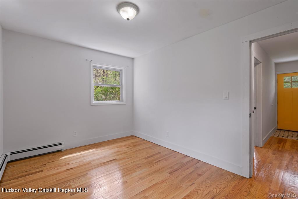 2 Mountain Valley Road Boiceville, NY 12412 - Photo 17 of 42 an empty room with wooden floor and windows