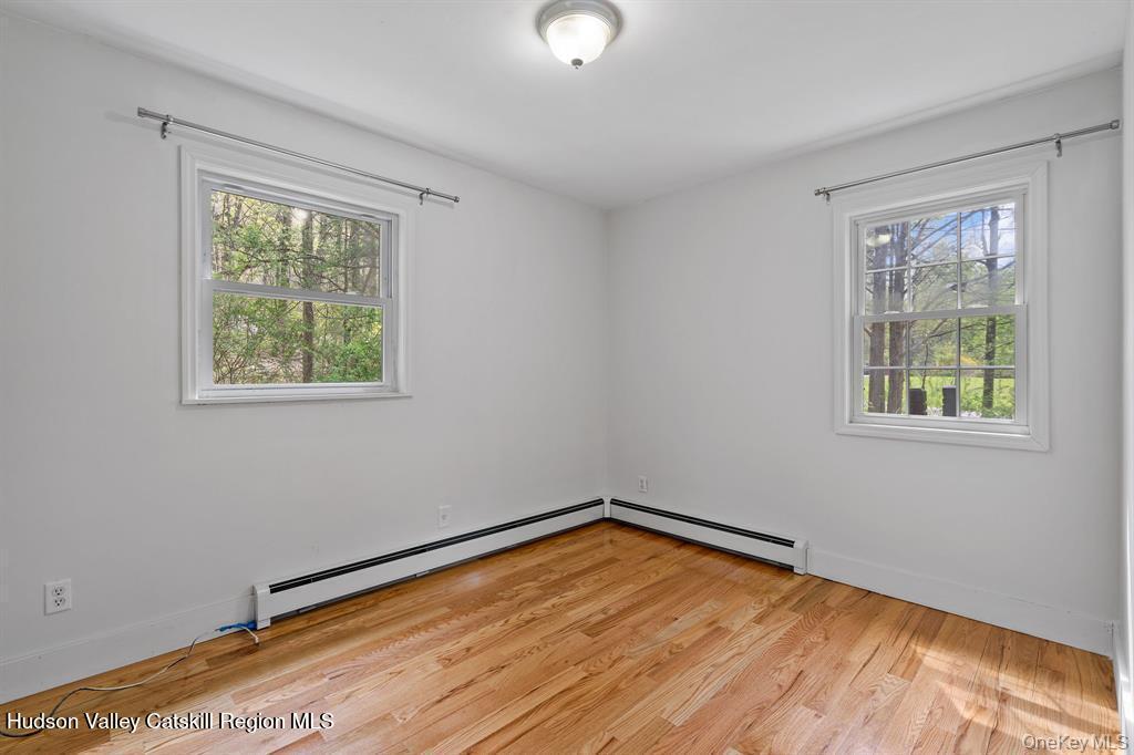 2 Mountain Valley Road Boiceville, NY 12412 - Photo 19 of 42 a view of empty room with wooden floor and fan