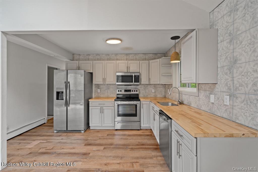 2 Mountain Valley Road Boiceville, NY 12412 - Photo 22 of 42 a kitchen with stainless steel appliances granite countertop a refrigerator stove and sink