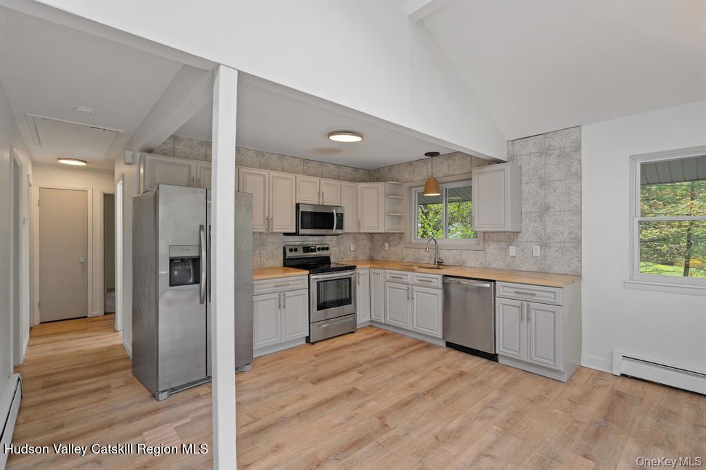 2 Mountain Valley Road Boiceville, NY 12412 - Photo 23 of 42 a large kitchen with cabinets wooden floor and stainless steel appliances