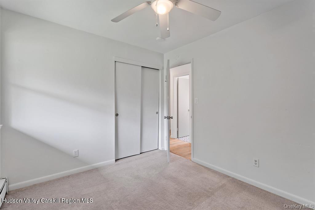 2 Mountain Valley Road Boiceville, NY 12412 - Photo 28 of 42 an empty room with a ceiling fan