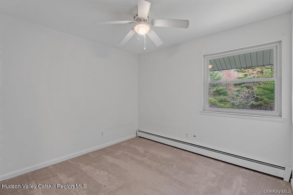 2 Mountain Valley Road Boiceville, NY 12412 - Photo 29 of 42 an empty room with a window and a fan