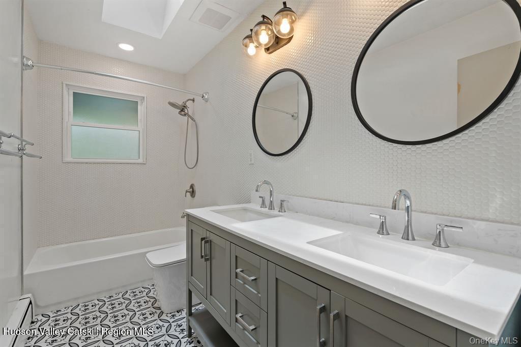 2 Mountain Valley Road Boiceville, NY 12412 - Photo 30 of 42 a bathroom with a sink a toilet and a mirror