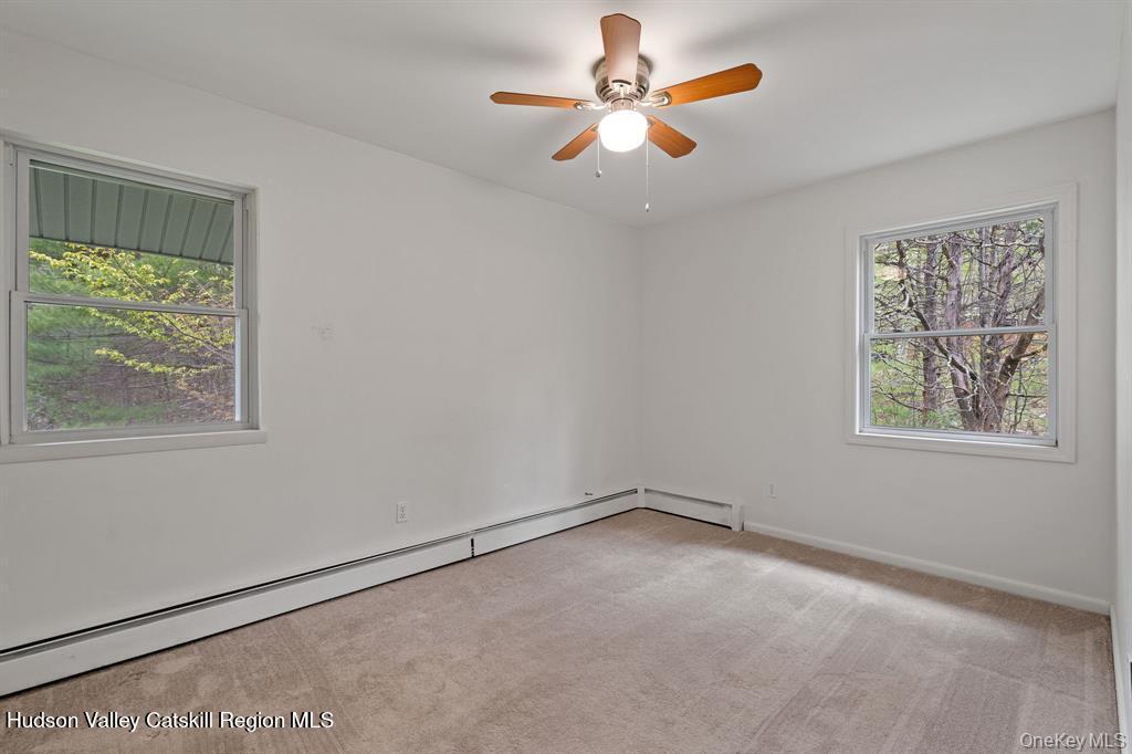 2 Mountain Valley Road Boiceville, NY 12412 - Photo 31 of 42 an empty room with a window and a fan