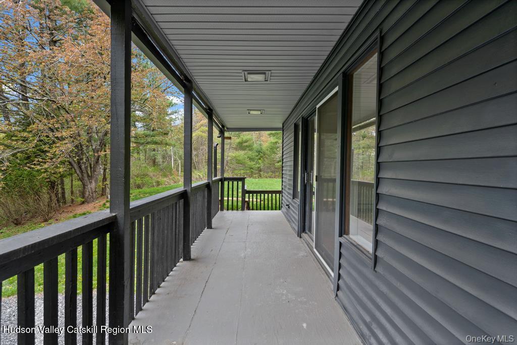 2 Mountain Valley Road Boiceville, NY 12412 - Photo 35 of 42 a view of a porch with wooden floor and stairs