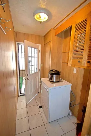 a kitchen with a stove a sink and a refrigerator