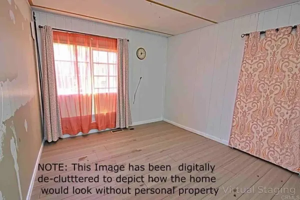 a view of a room with a window and a wooden door