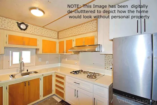 a kitchen with a stove a sink and a refrigerator