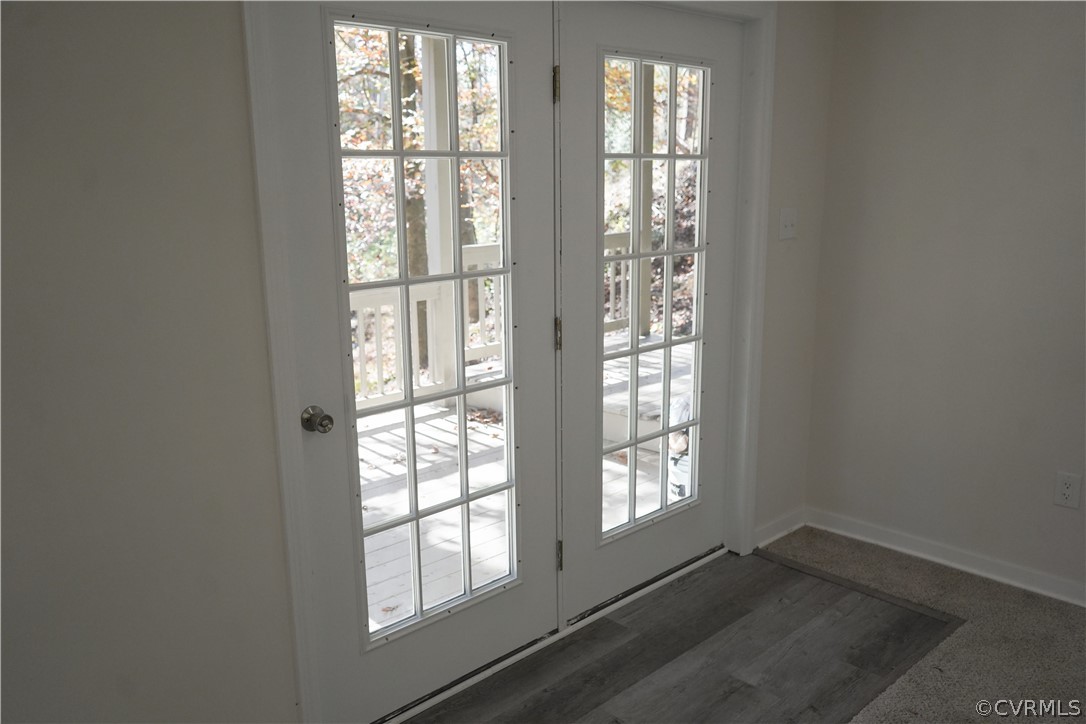 3717 Pfost Avenue Prince George, VA 23875 - Photo 19 of 39 an empty room with wooden floor and windows
