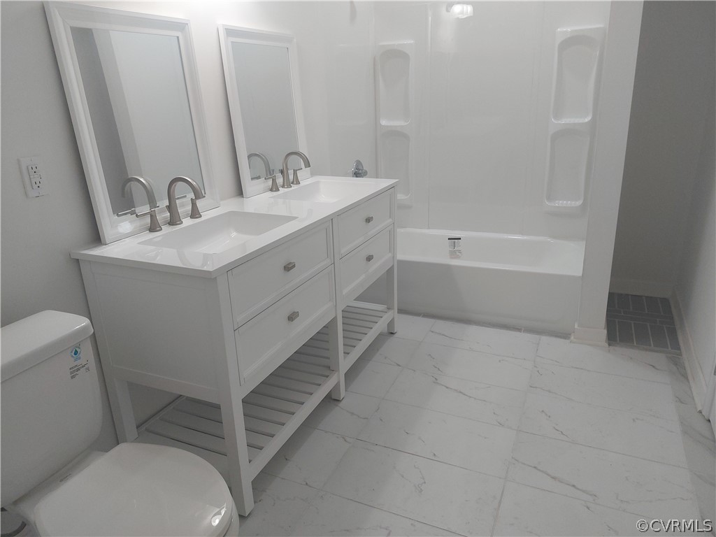 3717 Pfost Avenue Prince George, VA 23875 - Photo 23 of 39 a bathroom with a sink a toilet and shower