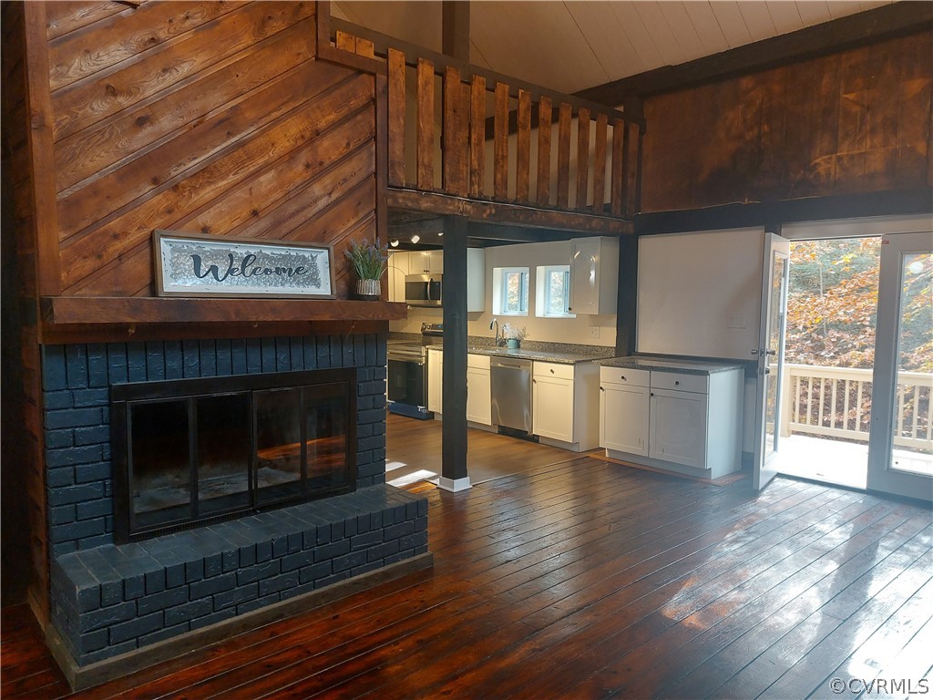 3717 Pfost Avenue Prince George, VA 23875 - Photo 26 of 39 a view of kitchen with granite countertop stainless steel appliances and wooden floor