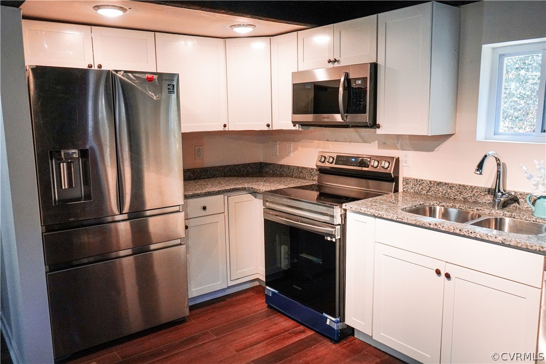 3717 Pfost Avenue Prince George, VA 23875 - Photo 6 of 39 a kitchen with stainless steel appliances a refrigerator microwave and sink