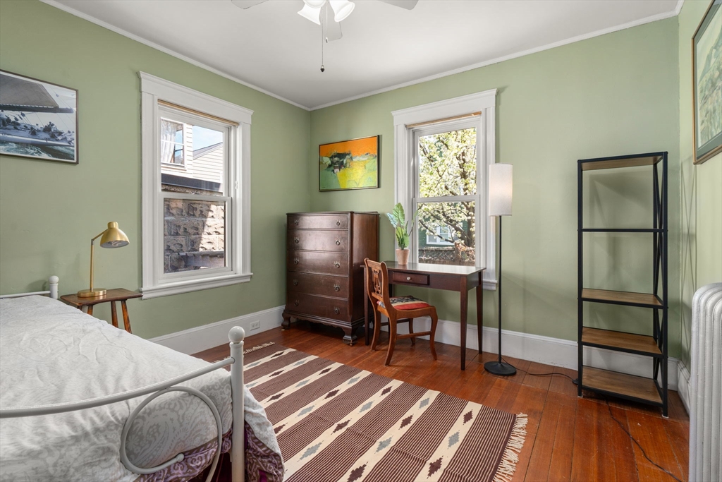 45 Springfield Street, Unit 1 Belmont, MA 02478 - Photo 17 of 27 a bedroom with furniture and a window