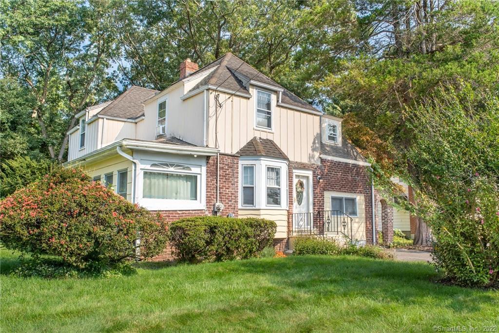 193 Frenchtown Road Bridgeport, CT 06606 - Photo 1 of 1 a view of a white house with a big yard and large trees