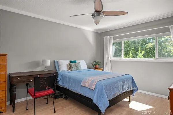 a bedroom with a bed and window