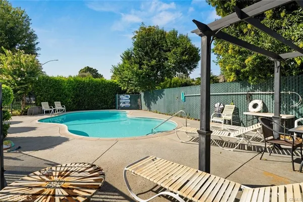 a view of a swimming pool with a patio