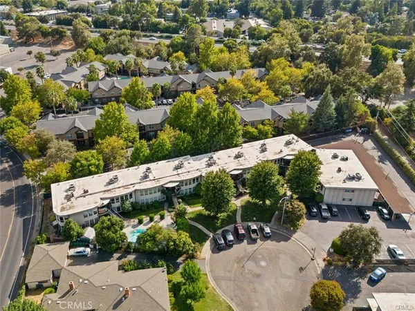an aerial view of a house with a yard basket and outdoor seating
