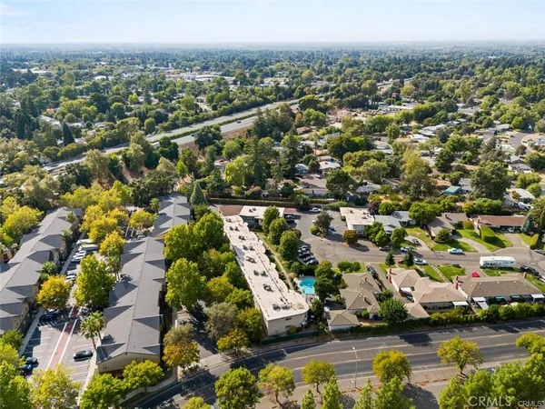an aerial view of residential houses with outdoor space