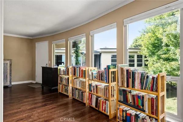 a living room with lots of furniture and windows