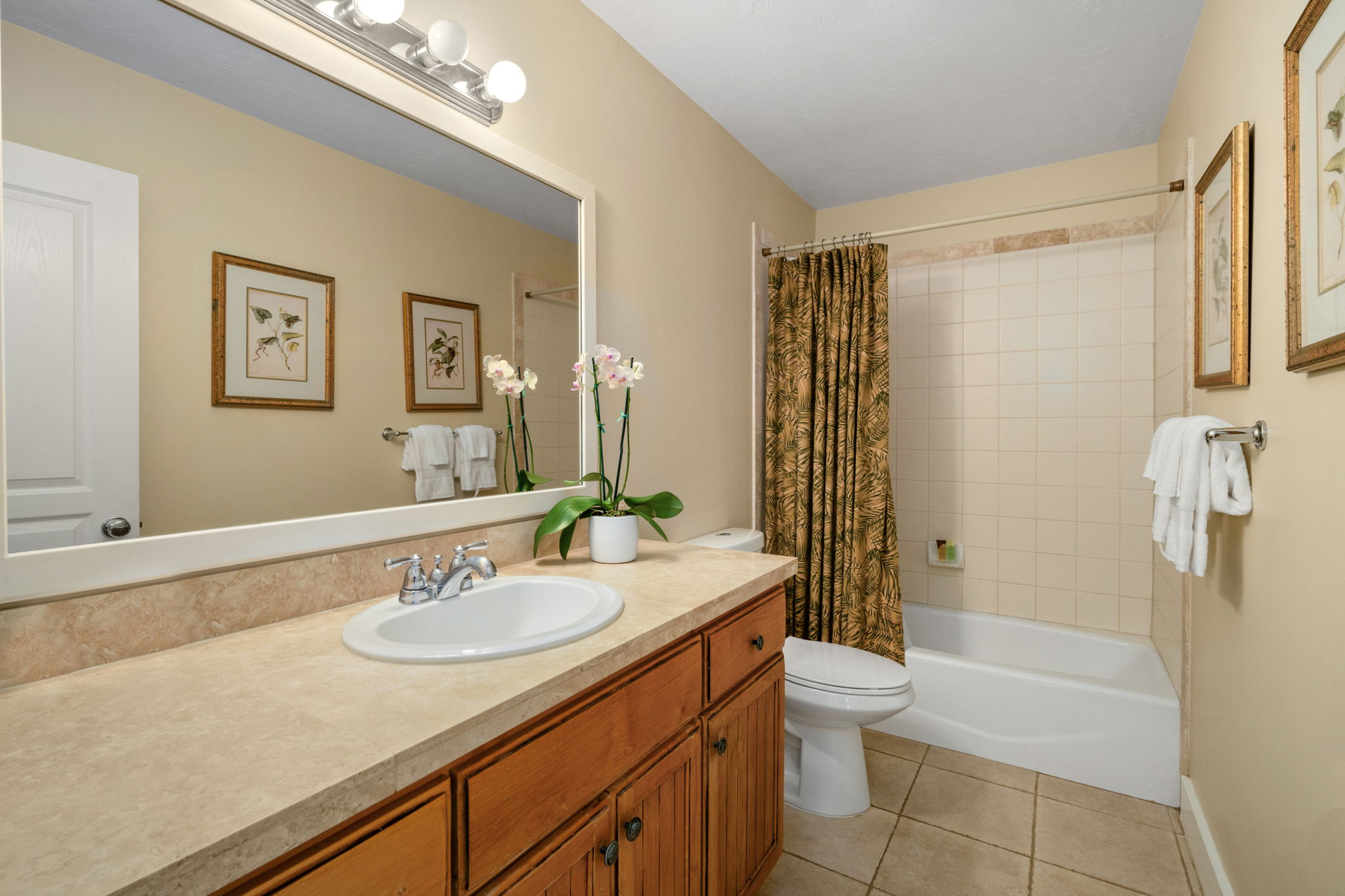 1831 Poipu Road, Unit 823 Koloa, HI 96756 - Photo 12 of 30 a bathroom with a sink a toilet and shower
