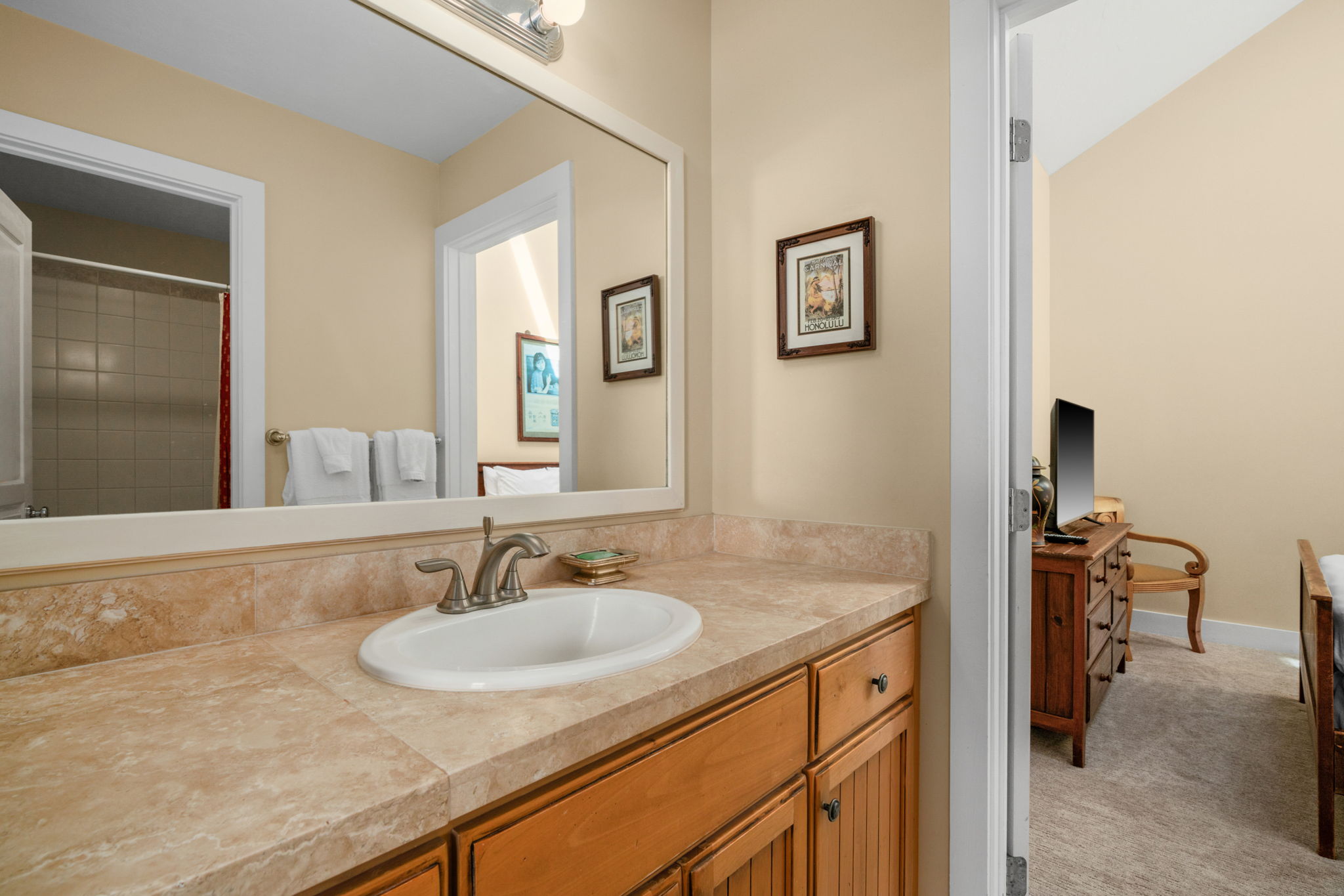 1831 Poipu Road, Unit 823 Koloa, HI 96756 - Photo 21 of 30 a bathroom with a granite countertop sink and a mirror