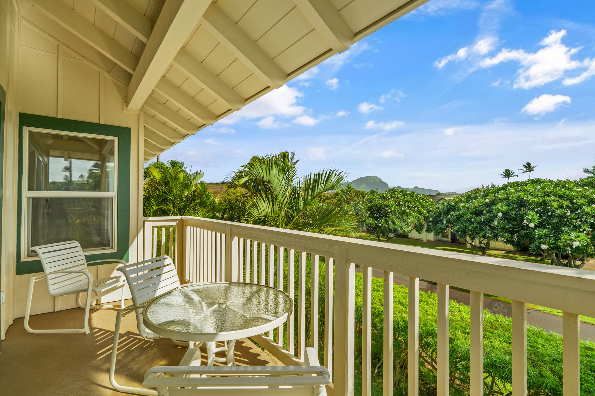 1831 Poipu Road, Unit 823 Koloa, HI 96756 - Photo 4 of 30 a view of a balcony with chair and wooden floor