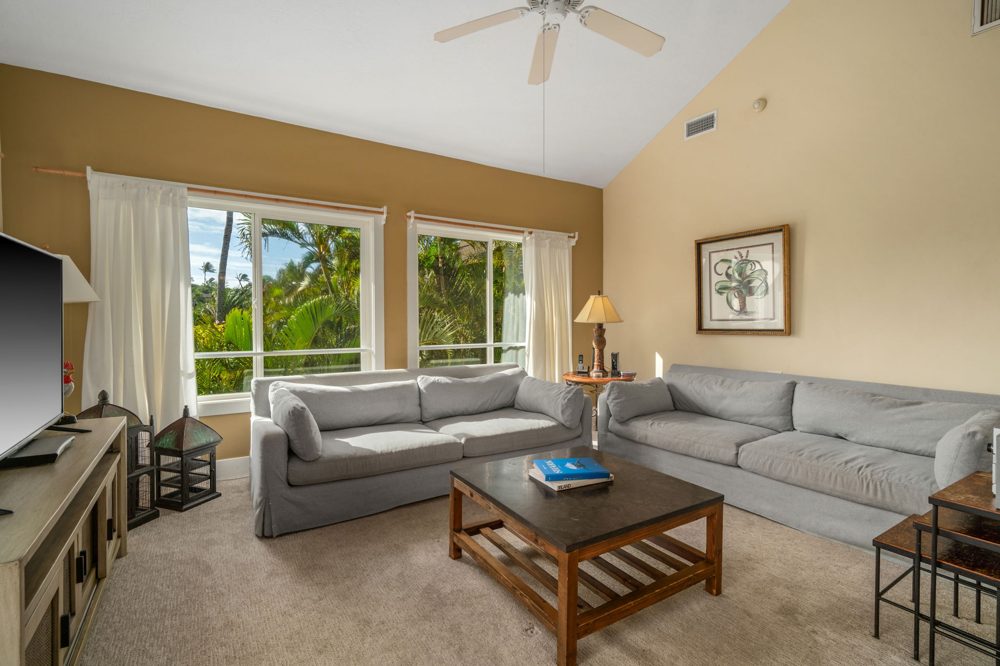 1831 Poipu Road, Unit 823 Koloa, HI 96756 - Photo 6 of 30 a living room with furniture and a flat screen tv