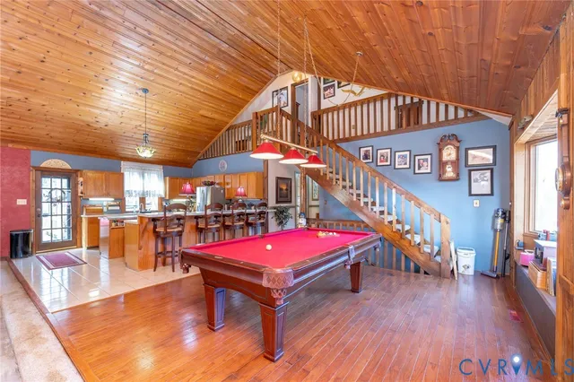 a living room with fireplace furniture and a window