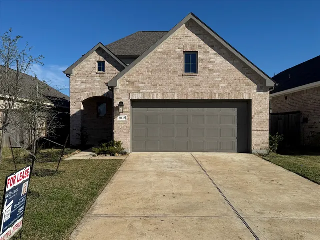 a front view of a house with garage