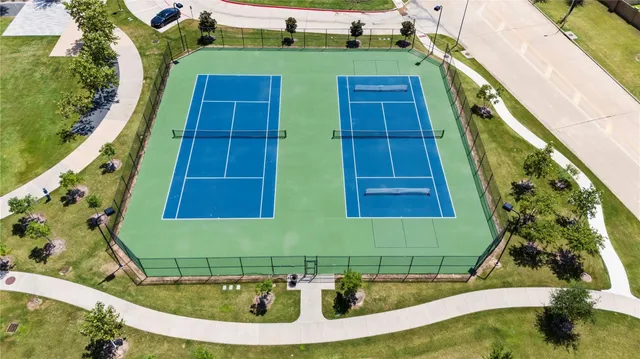 a view of a swimming pool with a yard