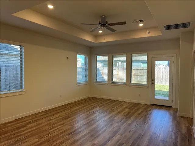 a white toilet sitting next to a bathroom sink and a mirror