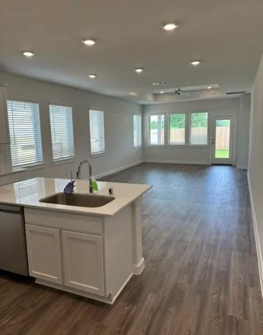 a kitchen with sink and window