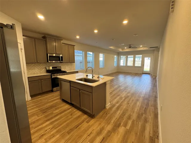 a bathroom with a shower and a glass door
