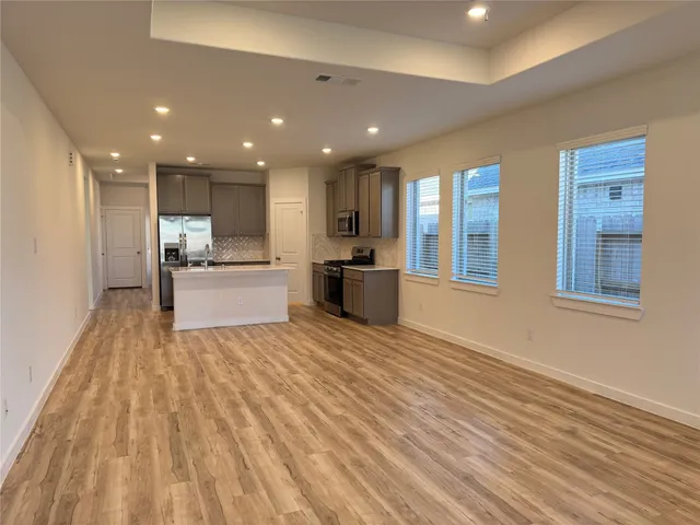 a view of an empty room and a window