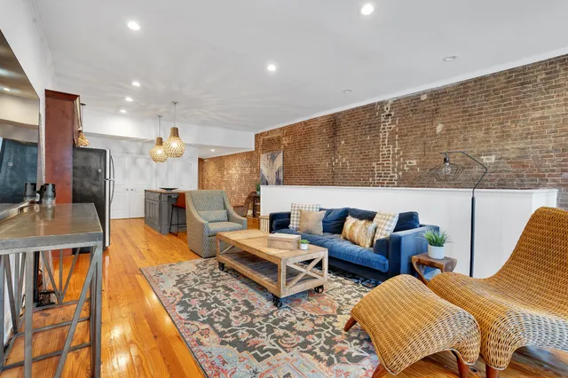 a living room with furniture and a rug