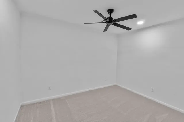 a view of a white wall and closet