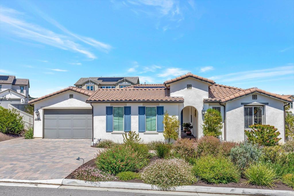 front view of a house with a garden
