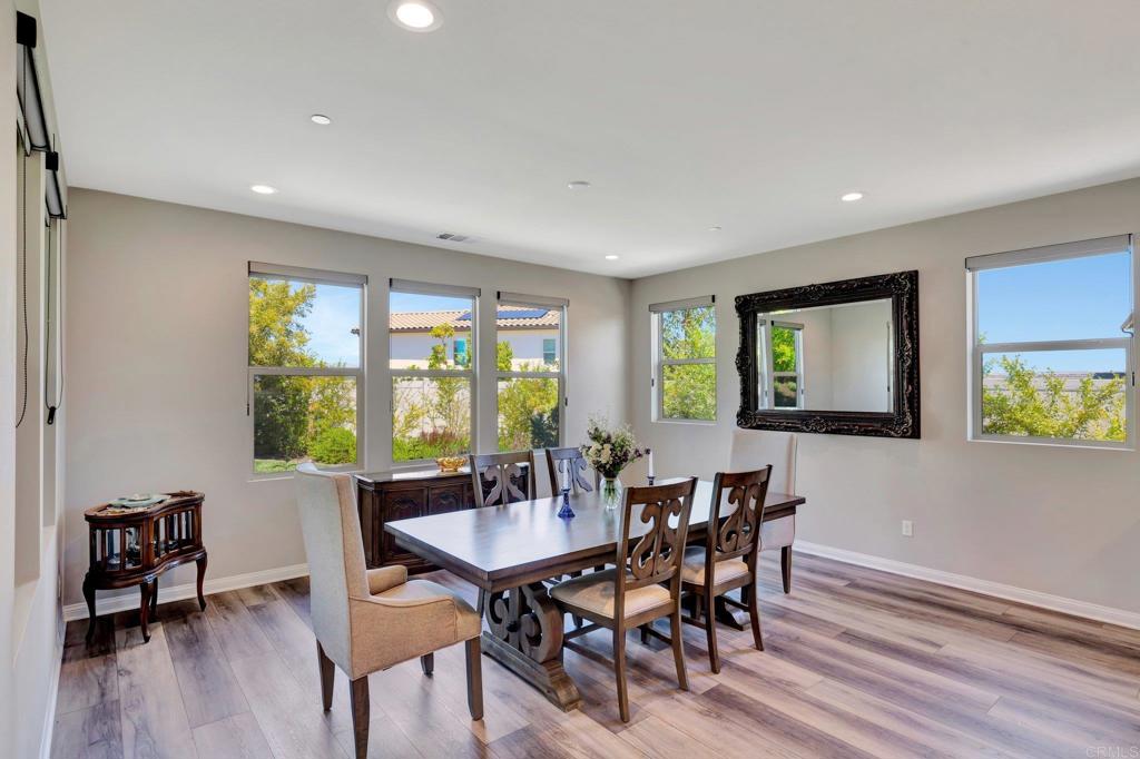 22005 Long Trot Drive Escondido, CA 92029 - Photo 12 of 51 a view of a dining room with furniture window and wooden floor