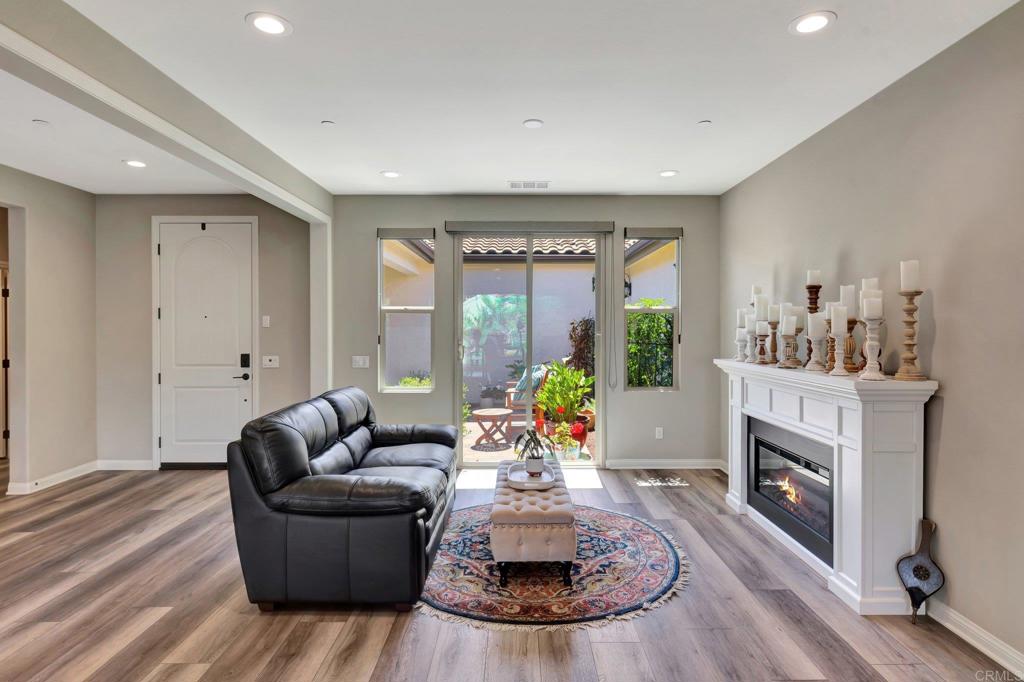 22005 Long Trot Drive Escondido, CA 92029 - Photo 17 of 51 a living room with furniture and a fireplace