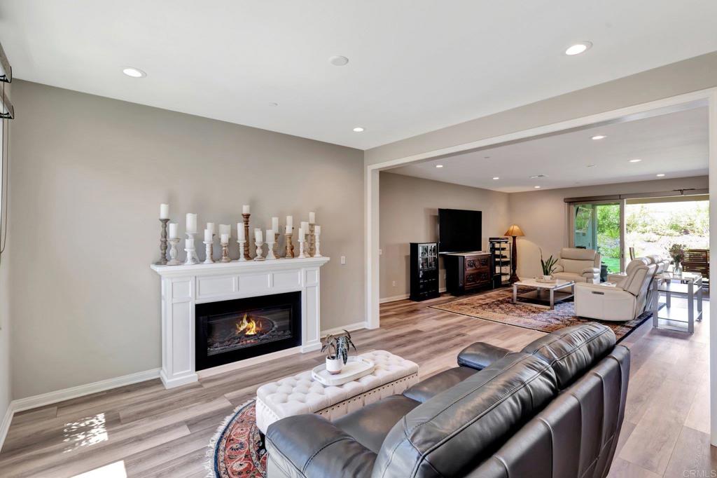 22005 Long Trot Drive Escondido, CA 92029 - Photo 18 of 51 a living room with furniture and a fireplace