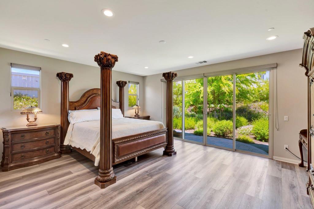 22005 Long Trot Drive Escondido, CA 92029 - Photo 19 of 51 a bedroom with a bed and a large window