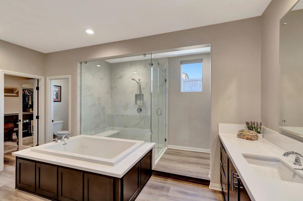 22005 Long Trot Drive Escondido, CA 92029 - Photo 20 of 51 a bathroom with a sink a toilet and shower