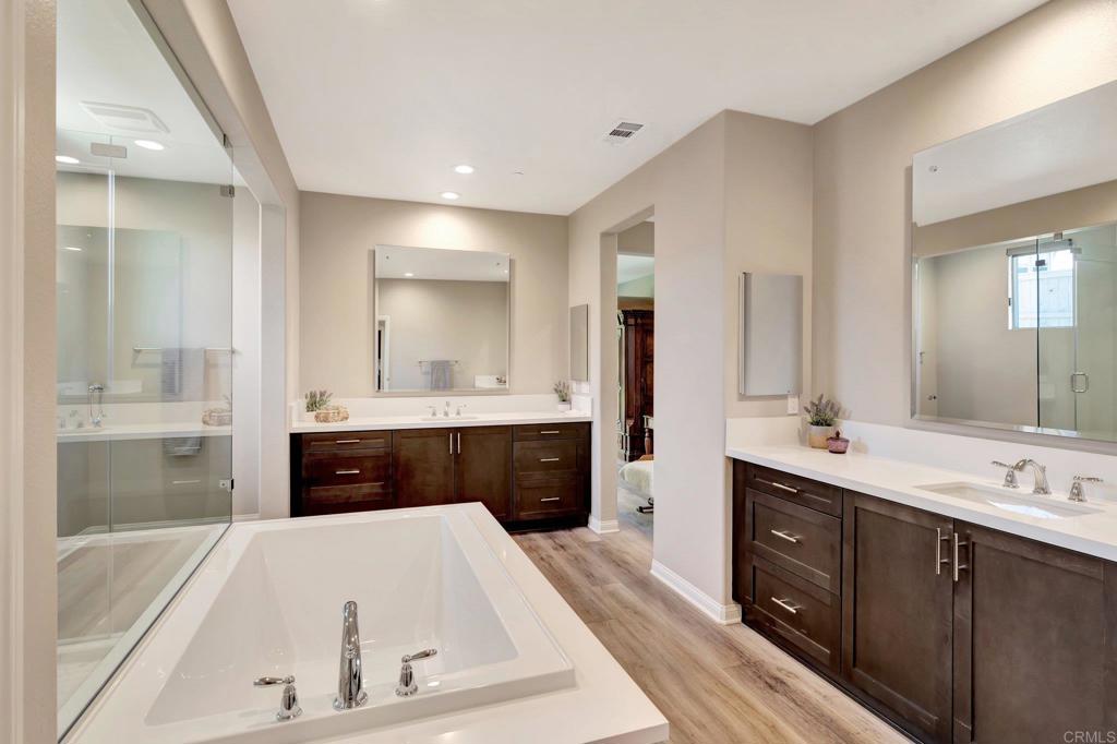 22005 Long Trot Drive Escondido, CA 92029 - Photo 21 of 51 a spacious bathroom with a tub sink shower and mirror