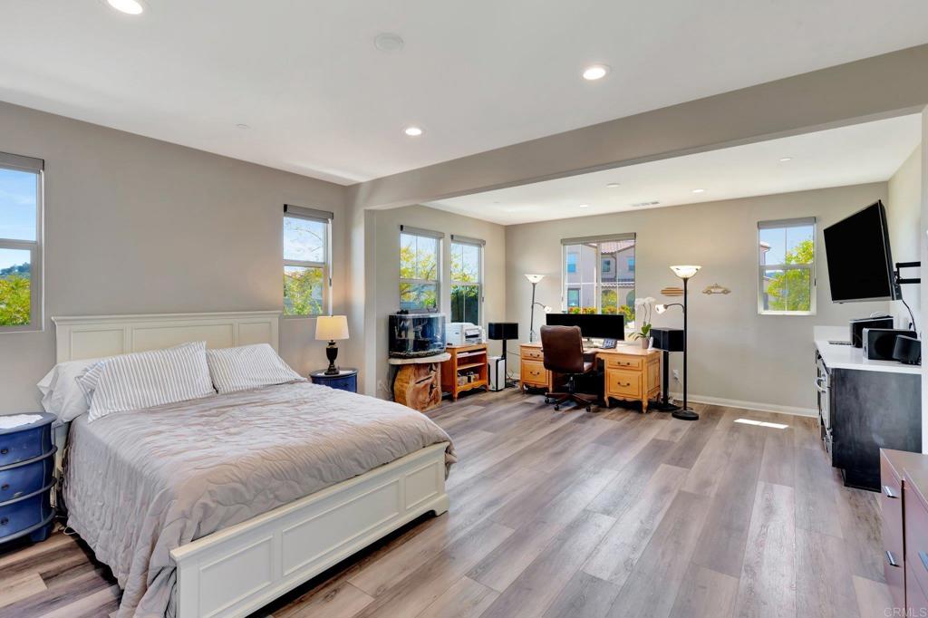 22005 Long Trot Drive Escondido, CA 92029 - Photo 25 of 51 a spacious bedroom with a bed and a flat tv screen on dresser