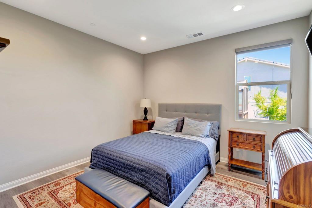 22005 Long Trot Drive Escondido, CA 92029 - Photo 29 of 51 a bedroom with a bed and a window