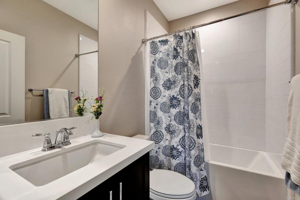 22005 Long Trot Drive Escondido, CA 92029 - Photo 31 of 51 a bathroom with a sink toilet and shower