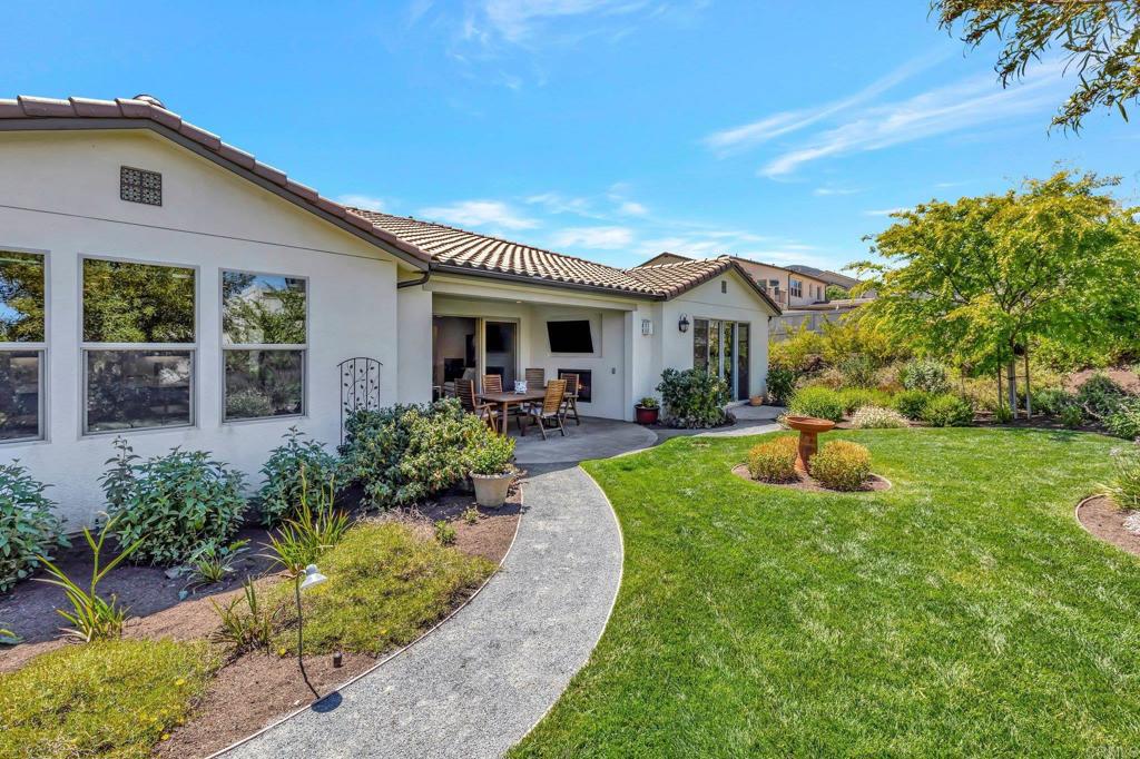 22005 Long Trot Drive Escondido, CA 92029 - Photo 33 of 51 a view of a house with backyard sitting area and garden