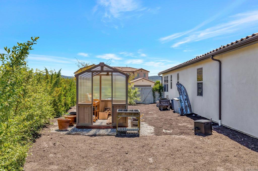 22005 Long Trot Drive Escondido, CA 92029 - Photo 38 of 51 a view of a car park in front of house